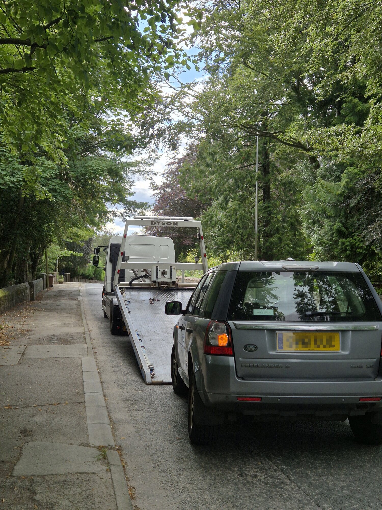 AFB Recovery truck attending a broken-down car on a roadside