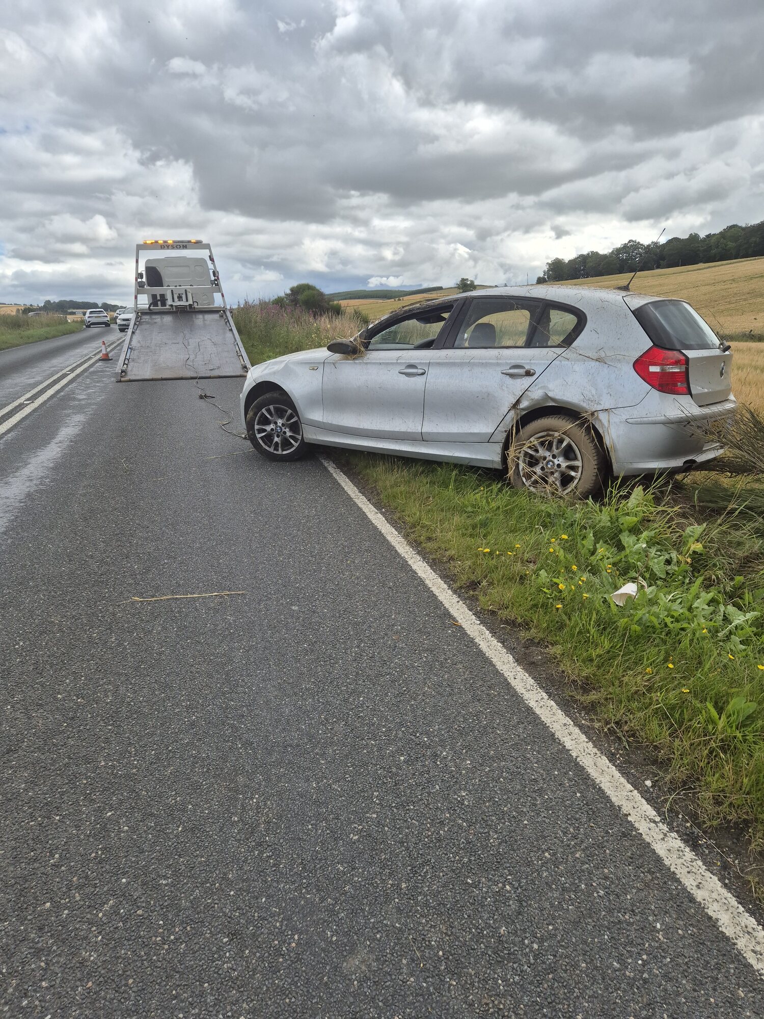 AFB Recovery truck attending an accident-damaged car at the roadside