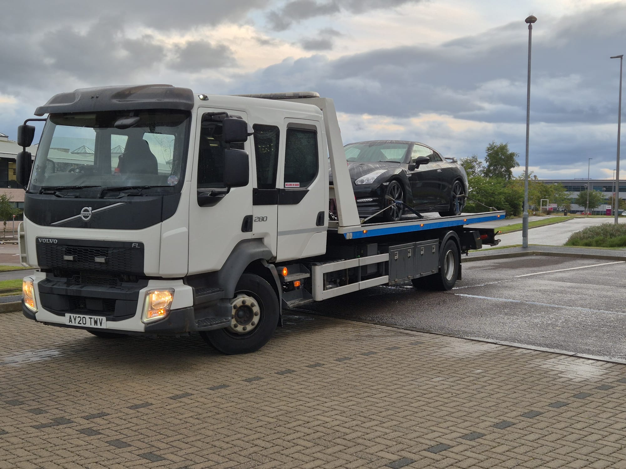 AFB Recovery transporting a prestige car on a flatbed